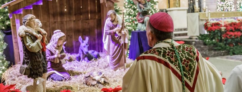 Bishop celebrates Christmas Masses, hosts dinner for seminarians